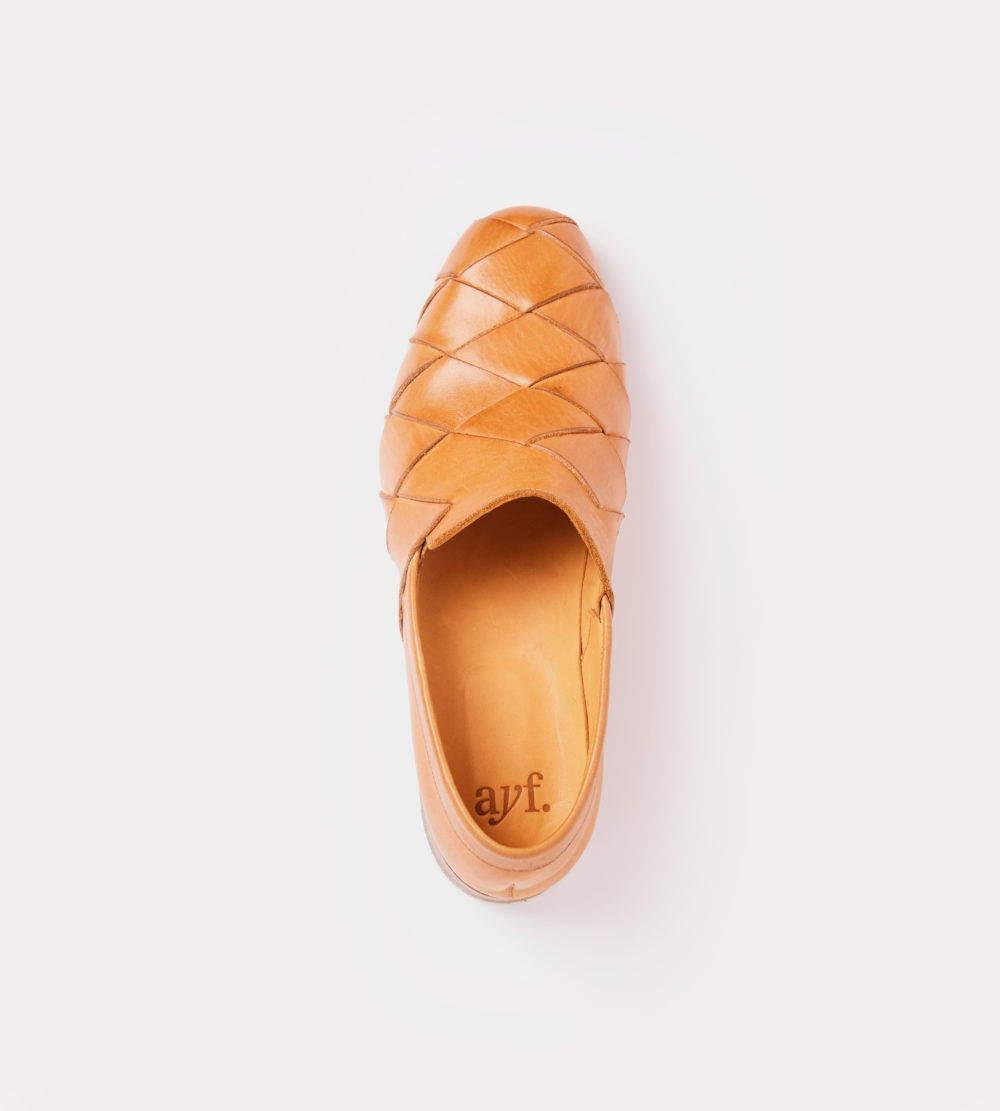 Hand woven slip-on in natural leather color - front